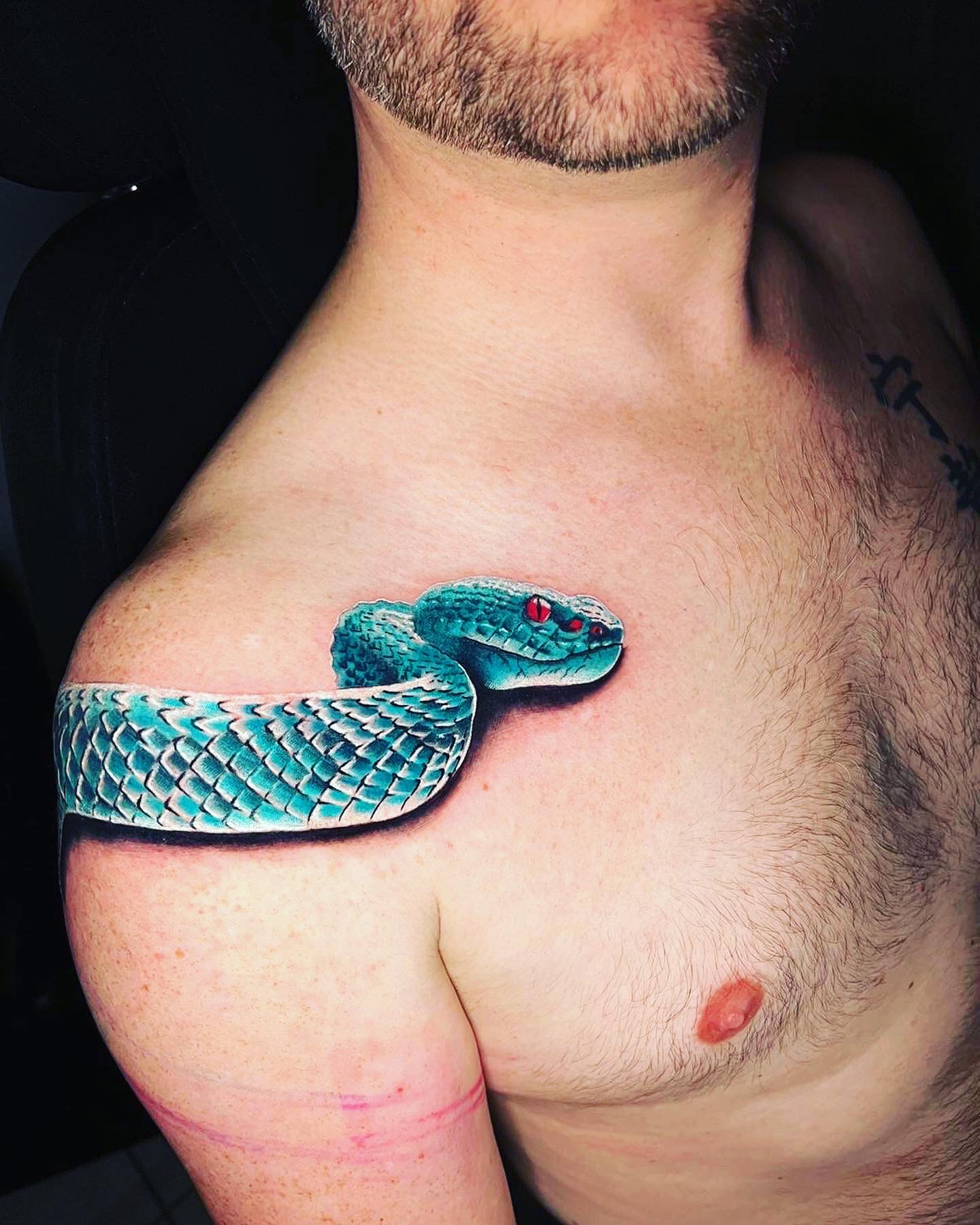 Fab's viper tattoo 1
